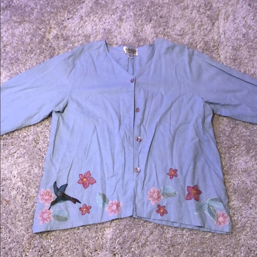 Woman’s long sleeve button down shirt.